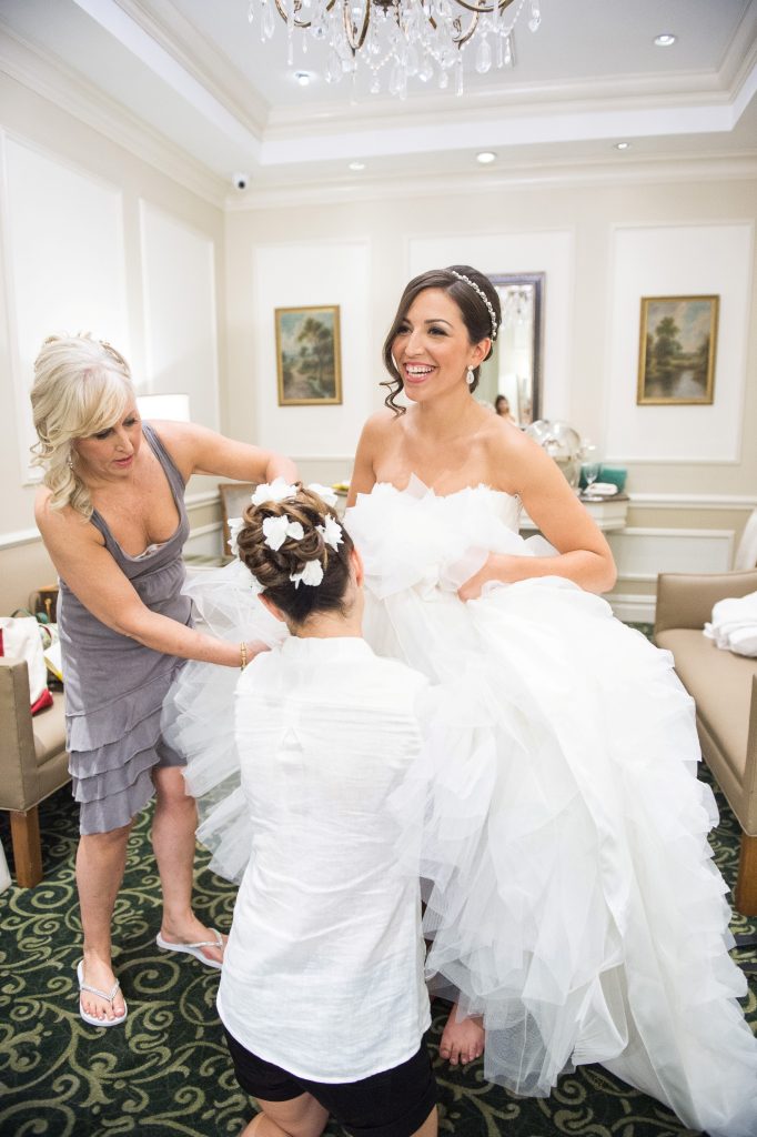 bride getting dressed hemmed