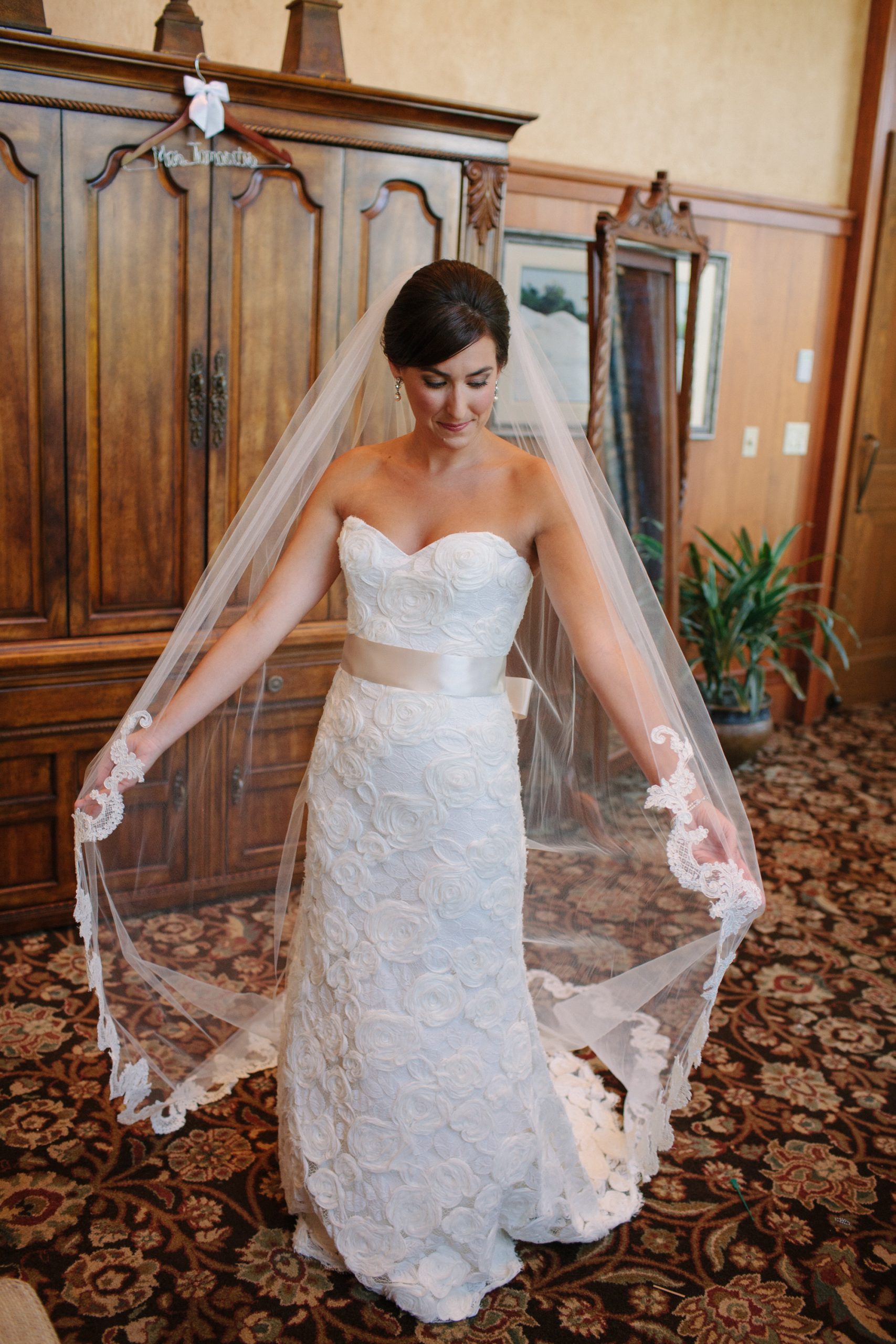 bride posing with veil