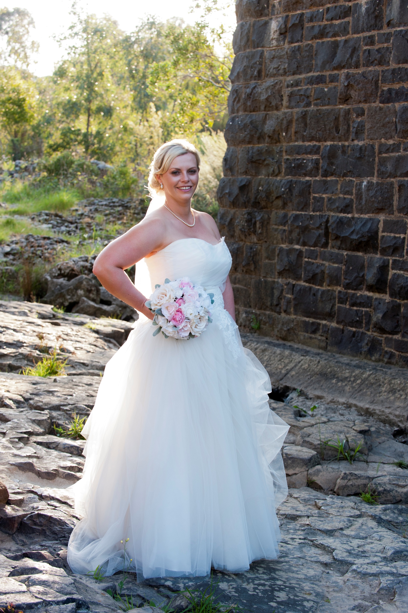 bride posing in ball gown style dress